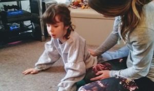 Yoga teachers using Story Massage Programme with a young child