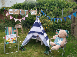 Sensory props including tent and teddy for storytelling.